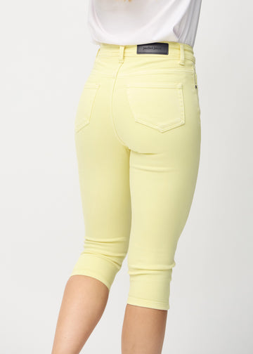 Close-up from the back of light yellow Skinny capris in Lemonades, highlighting the back pockets and stitching.