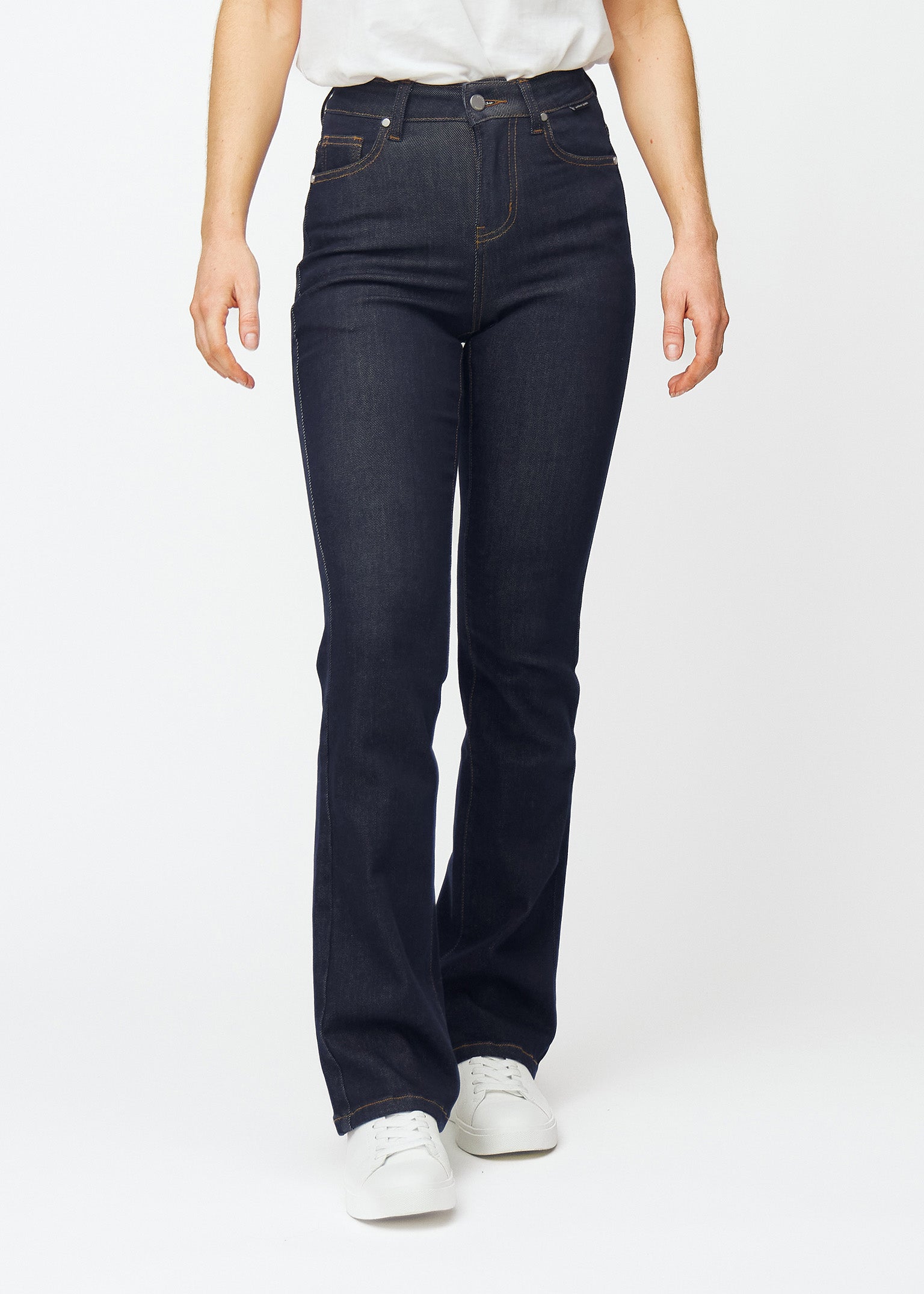 Deep dark blue denim jeans for women in the color Midnights with a bootcut fit that is fitted over the hips and thighs and has a slight flare at the ankles, seen from the front.