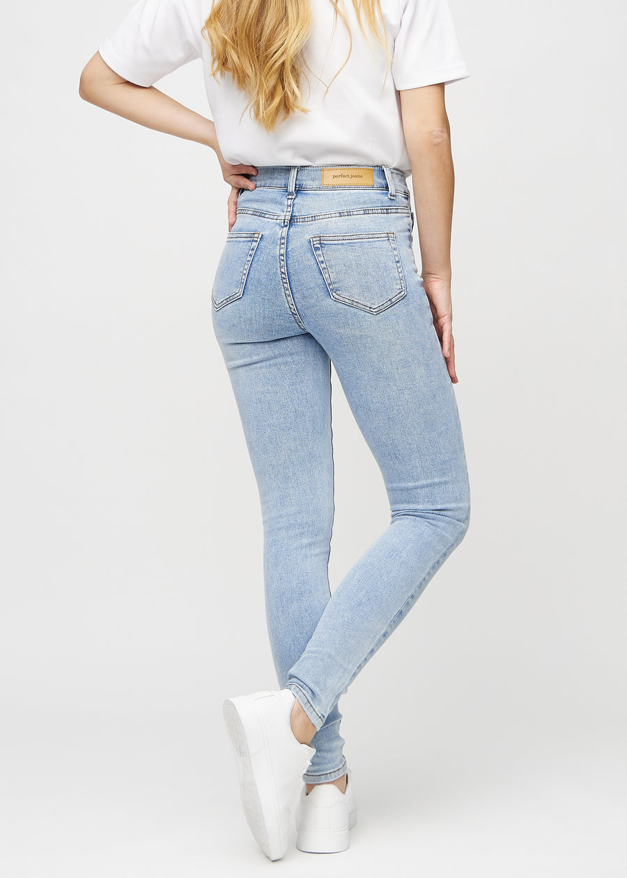 Skinny jeans for women in light blue, color Waves. Back view on a model, showing the full fit.