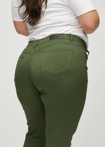 Slim jeans for women in dark green, color Renewals. Close-up back view on a plus-size model, showing the details.