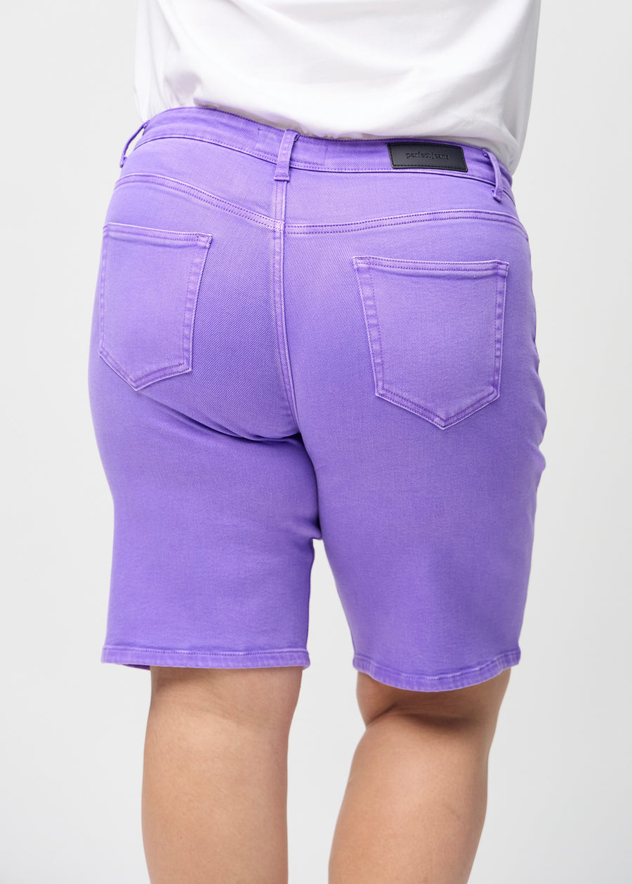Purple regular middle shorts seen from the back close up on a plus-size model to show details.