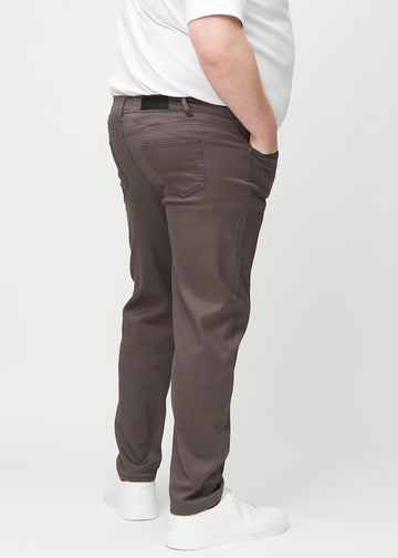 Grey-brown regular jeans seen from the back on a plus-size model, so the entire product can be seen.