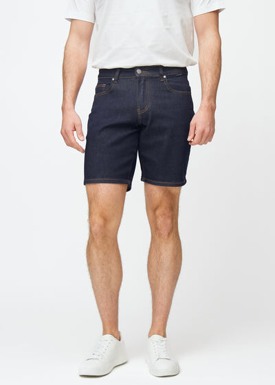 deep dark blue denim shorts for men in the colour midnights with a regular fit, sitting naturally at the hips and allowing room around the thighs, seen from the front.